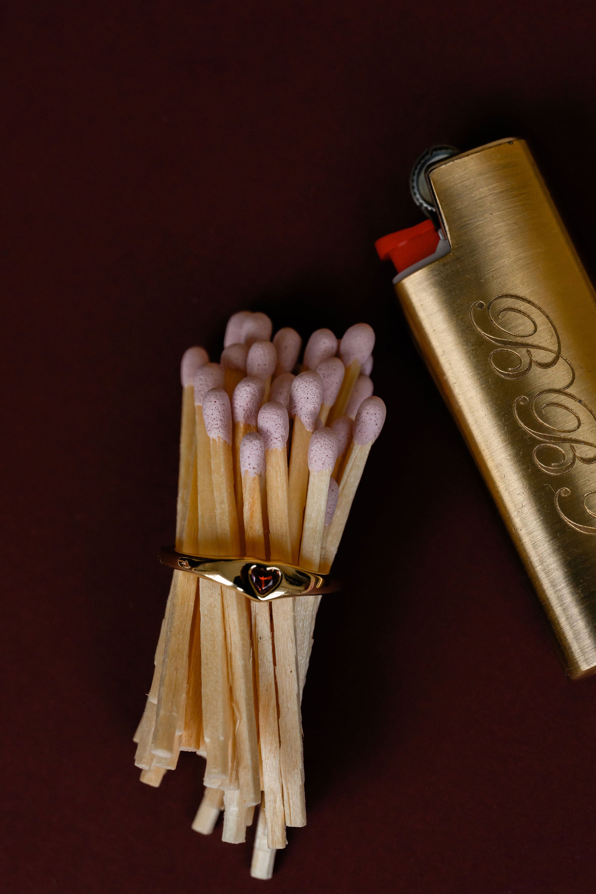 Matches and a lighter on a dark background