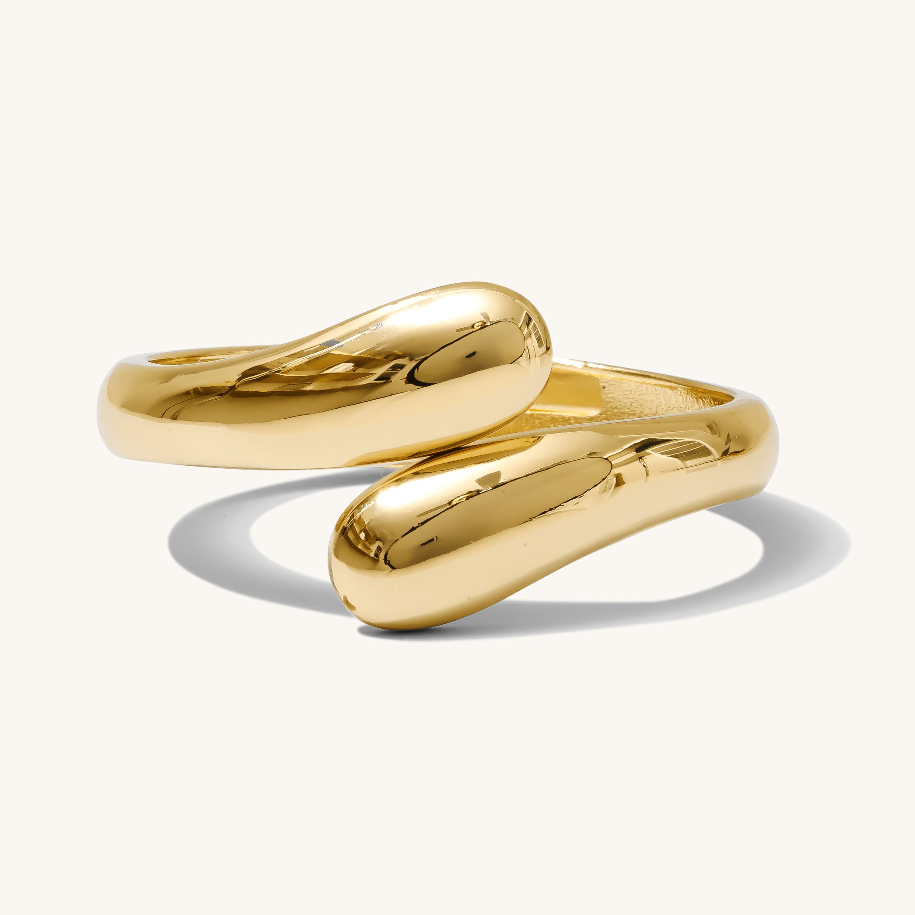 Two gold rings on a white background