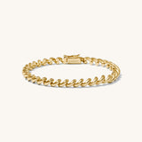 Gold bracelet on a white background