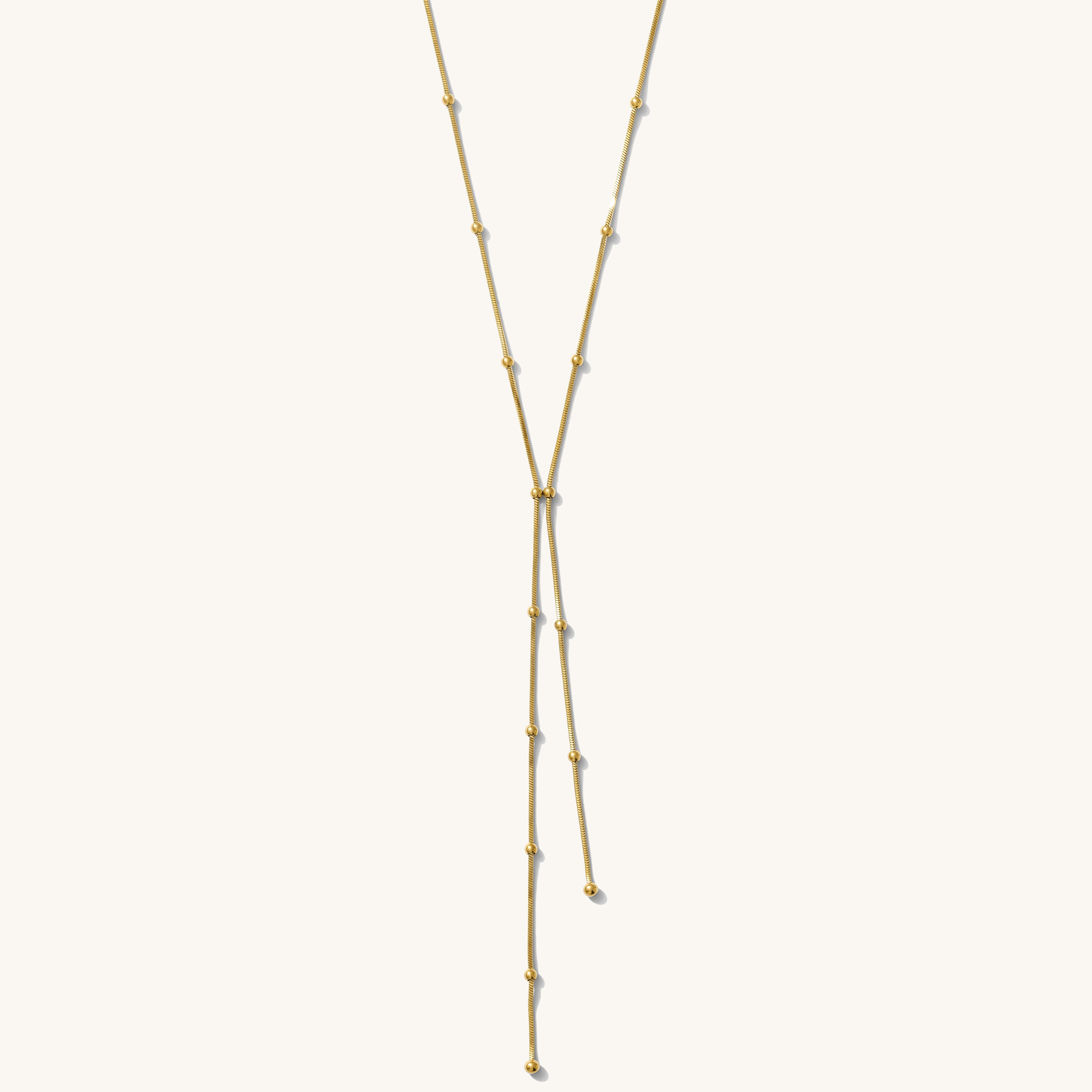 Gold necklace on a white background