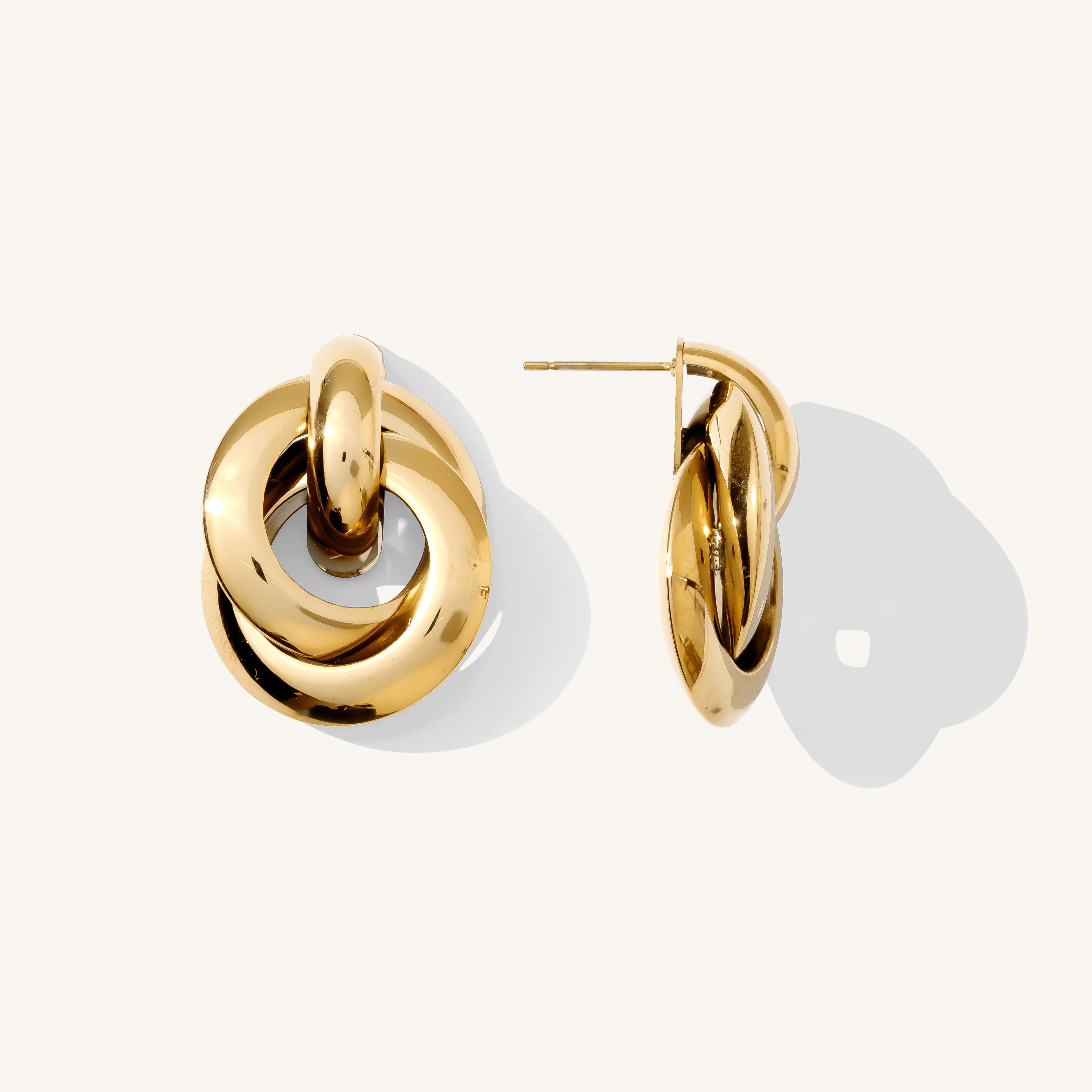 Close up of gold accent studs on a white background