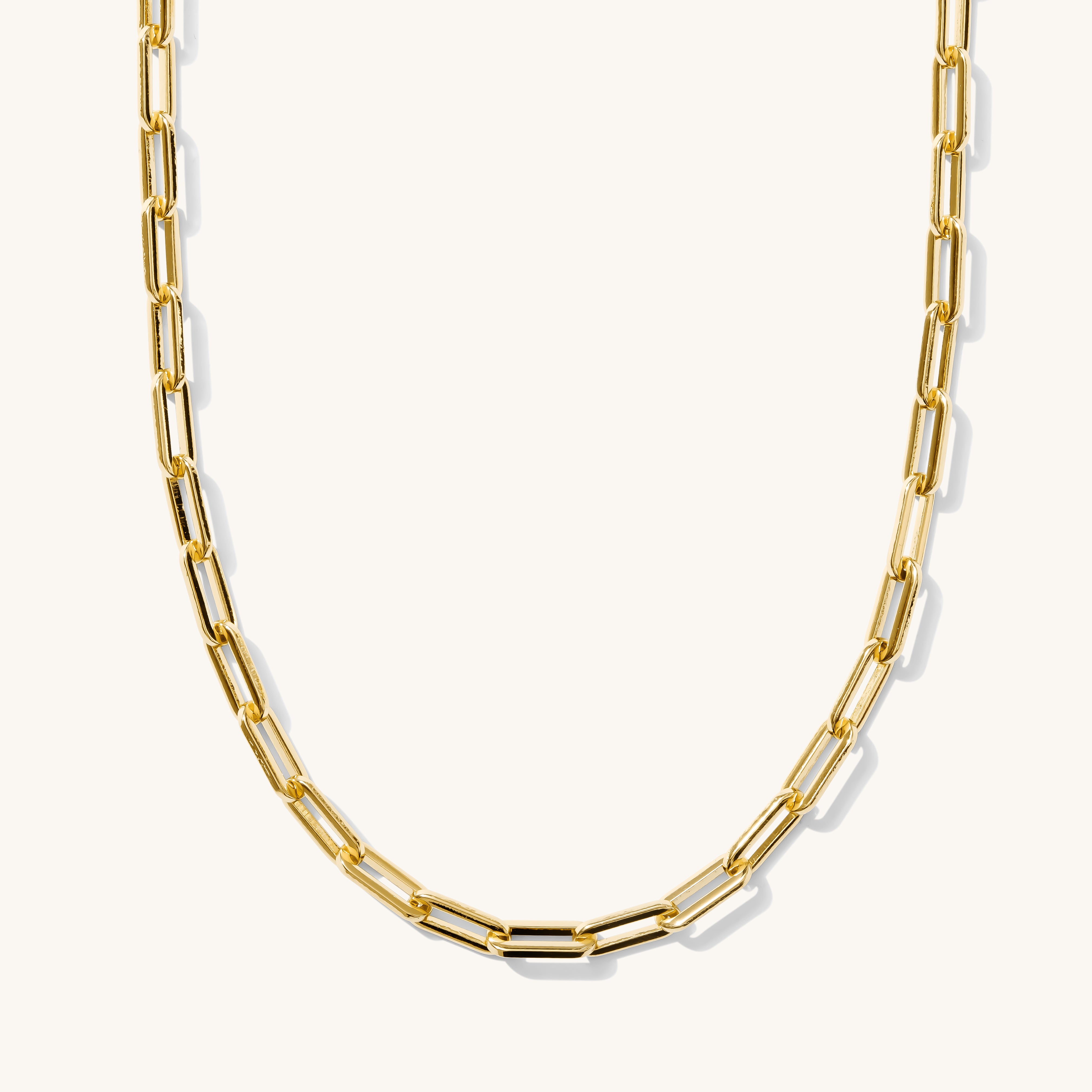 A gold-colored chain necklace with a series of linked segments.